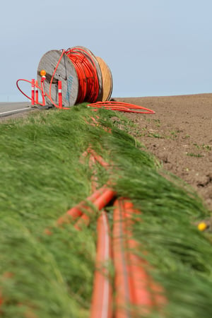 Orange cables demonstrate connecting rural areas to the broadband grid 41256213